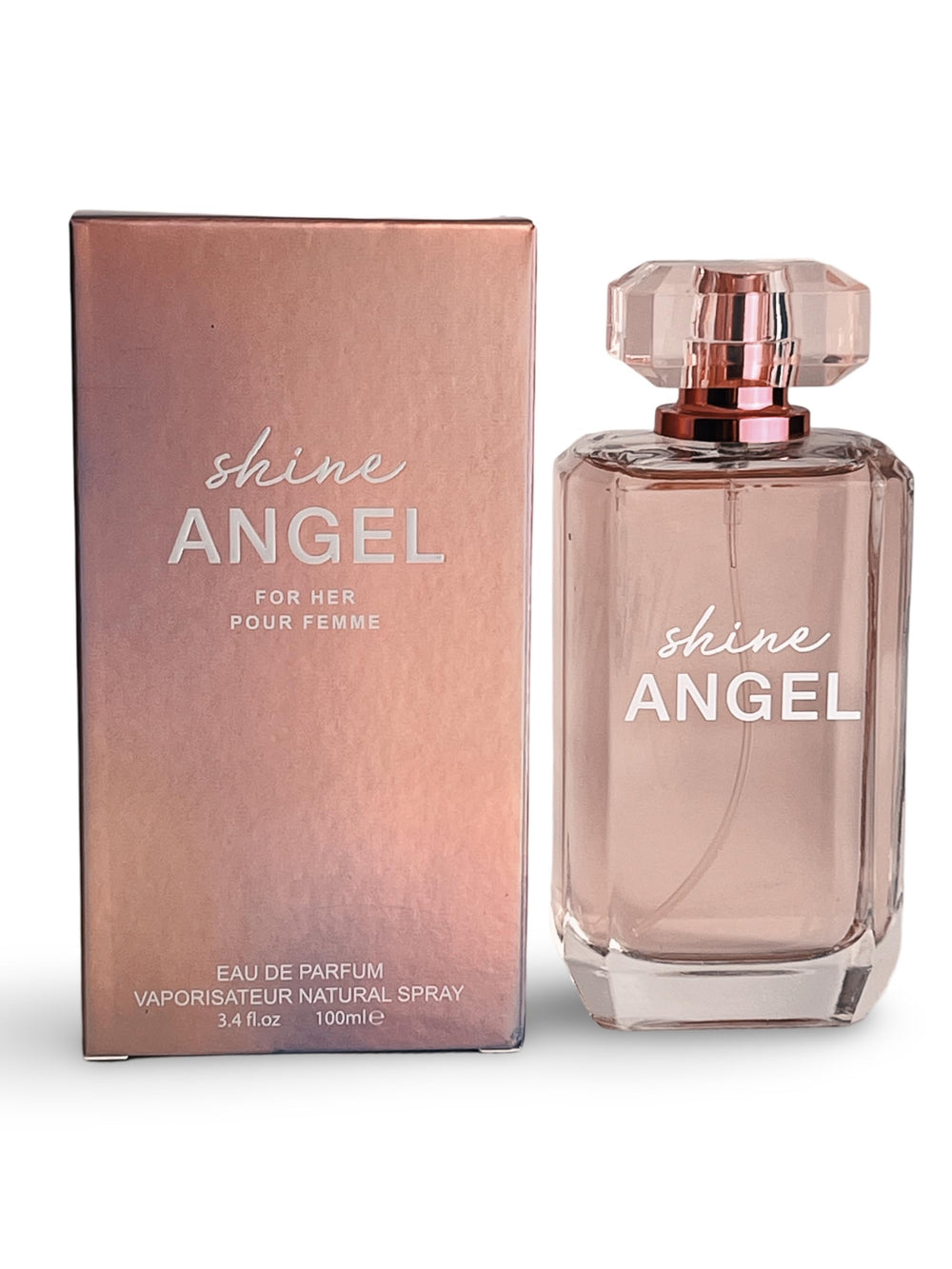United Scents Shine Angel bottle on vanity with amber glow for elegance.