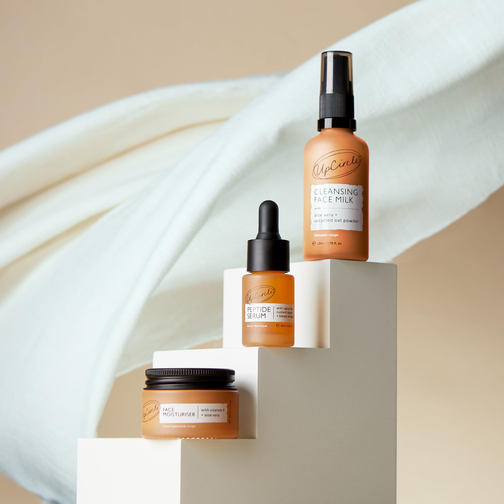 UPCIRCLE peptide serum bottle showcasing biomimetric peptides and renewal benefits