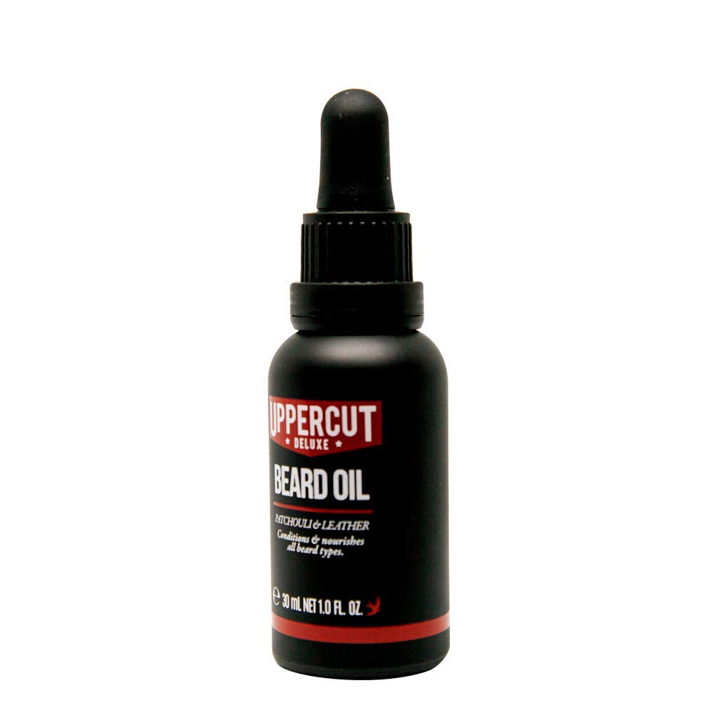 Uppercut Deluxe Beard Oil applied to beard for easy styling and dryness relief.