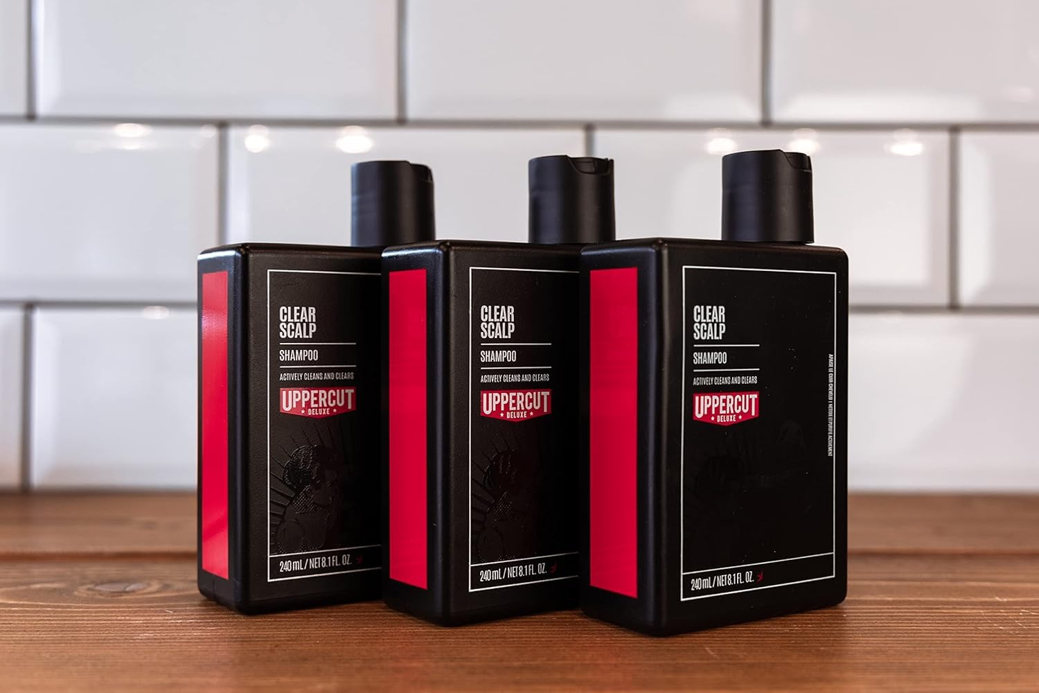 UPPERCUT DELUXE Clear Scalp Shampoo packaging close-up shows branding
