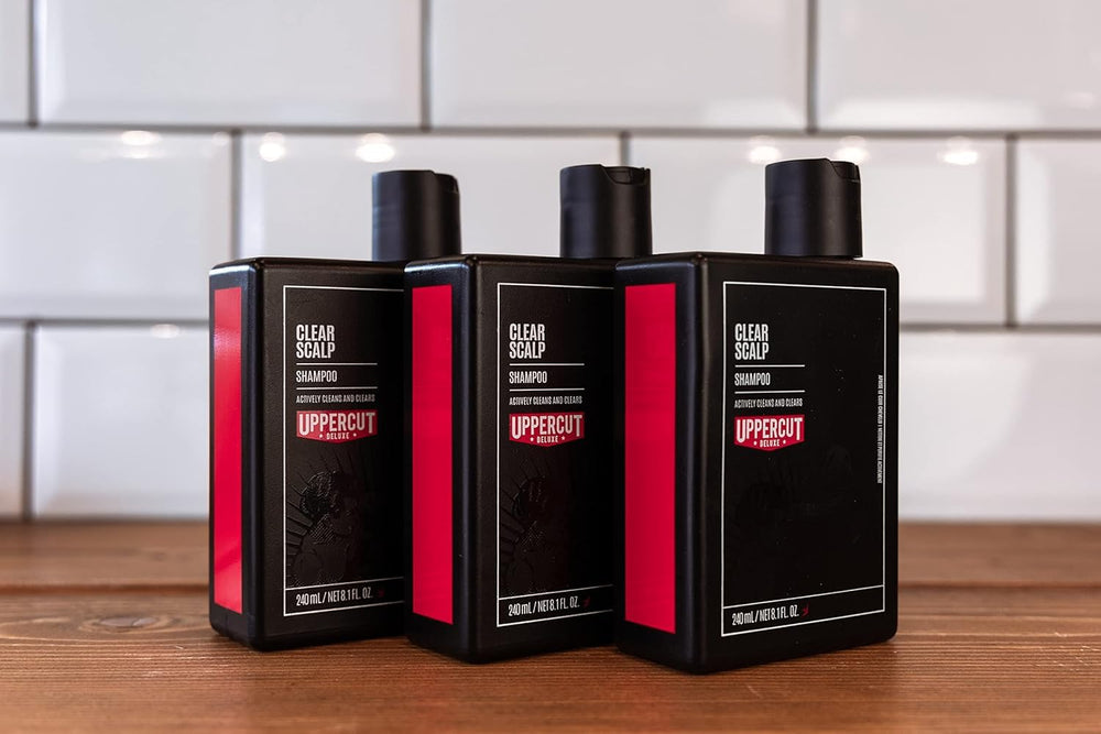 UPPERCUT DELUXE Clear Scalp Shampoo packaging close-up shows branding