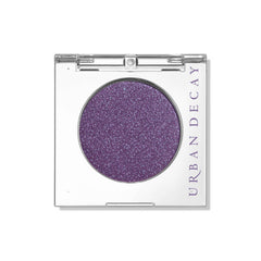 Urban Decay 24/7 Eyeshadow compact front view shows deep purple shimmer with blue shift and bold payoff.
