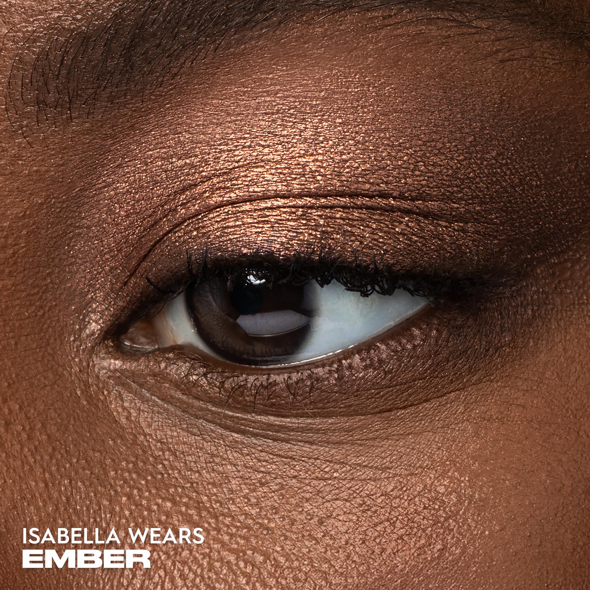 Urban Decay Ember metallic finish swatch highlights rich copper shine.