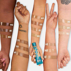 Urban Decay Hydromaniac swatch on skin showing buildable coverage and dewy finish