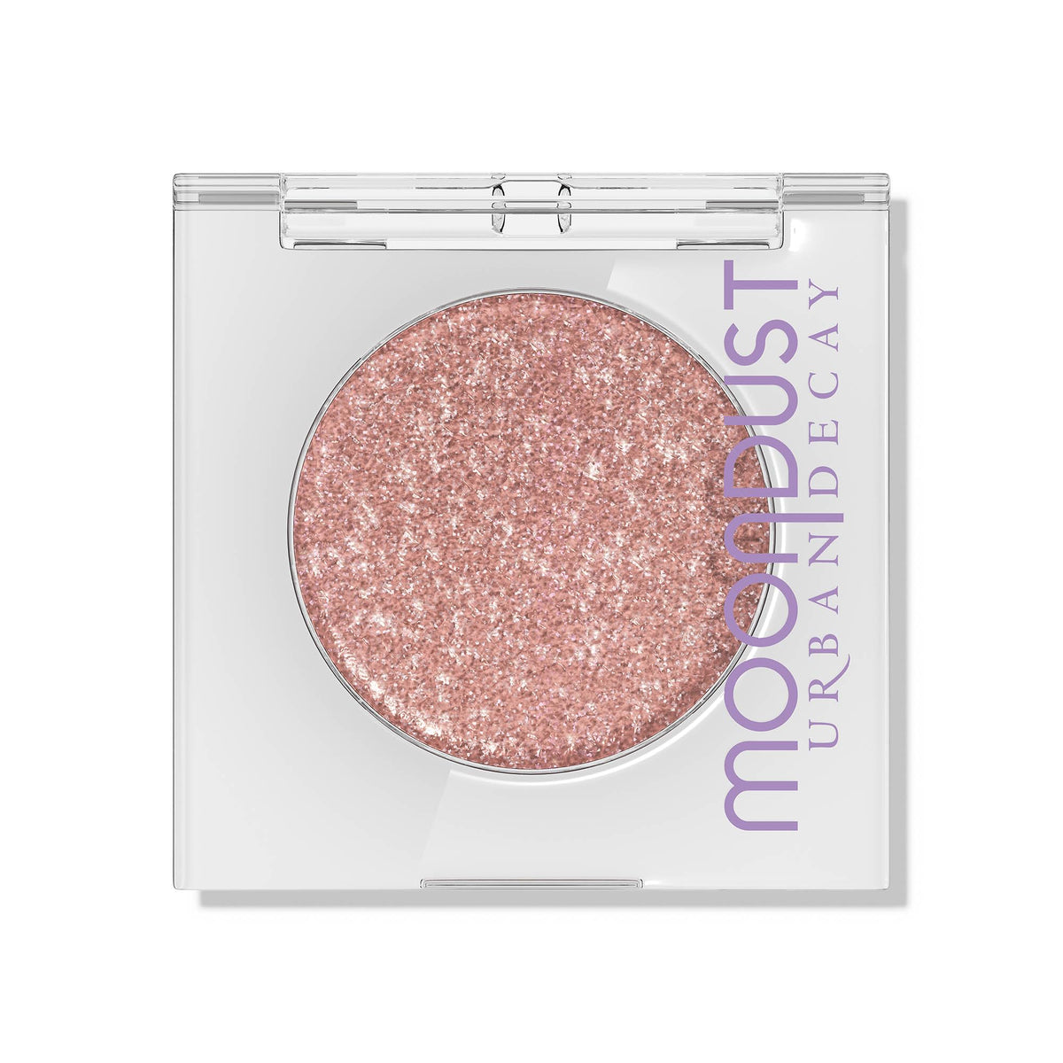 URBAN DECAY Moondust Crushin' Hard peach-pink swatch with silver pearls for everyday glow.