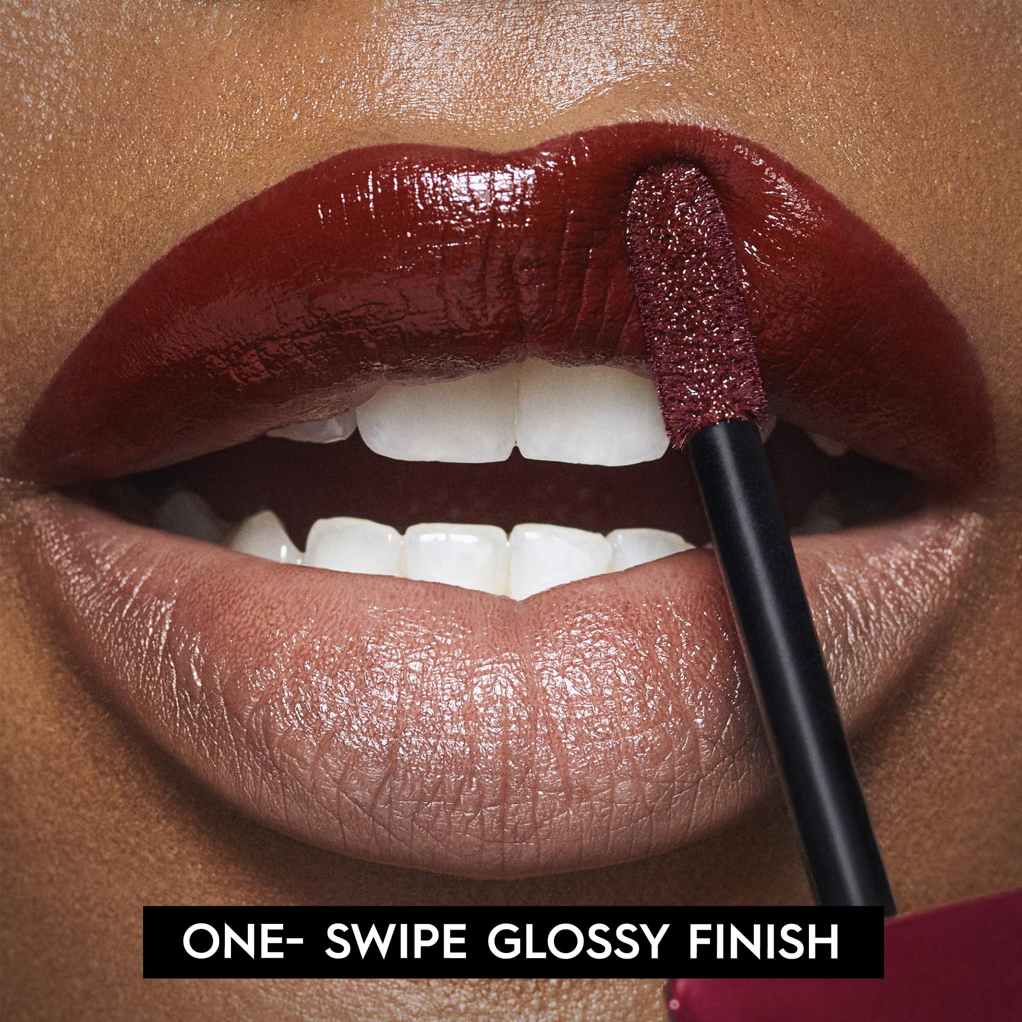 Urban Decay Vice Lip Bond merlot red swatch on lips shows full coverage.