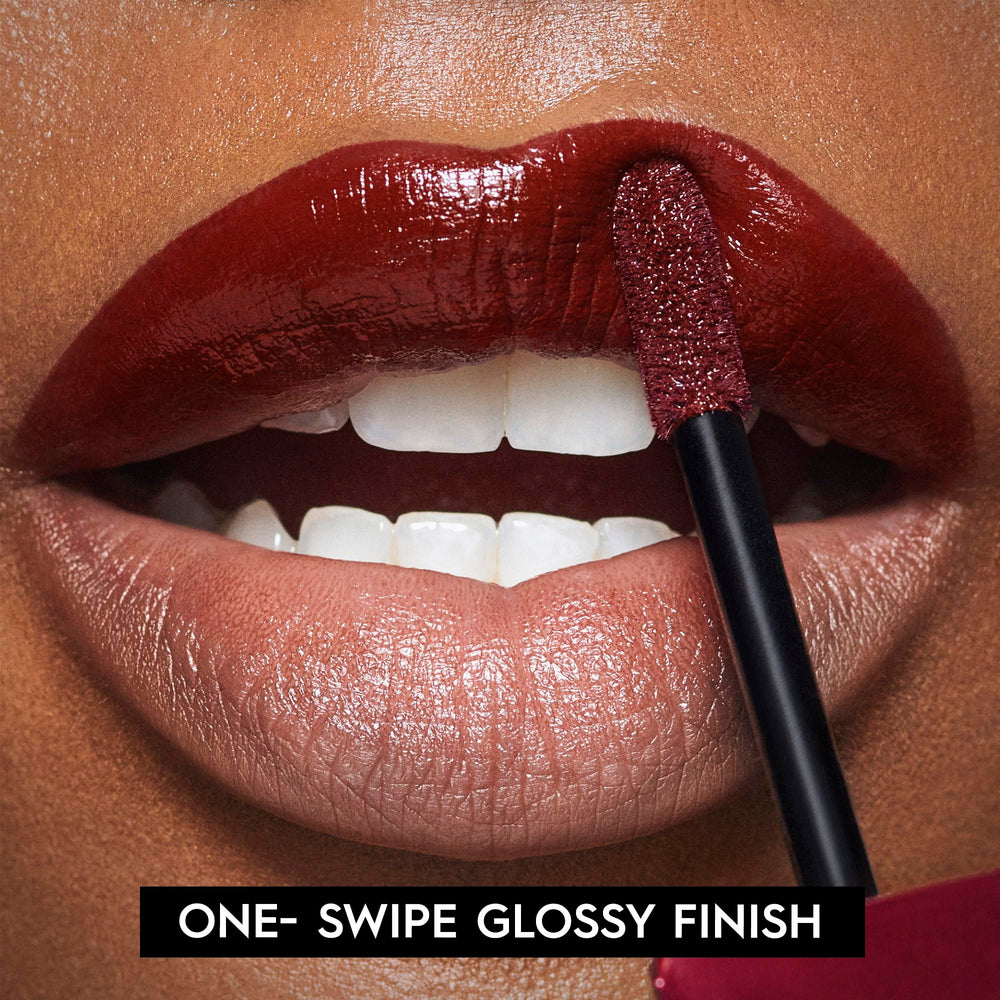 Urban Decay Vice Lip Bond merlot red swatch on lips shows full coverage.