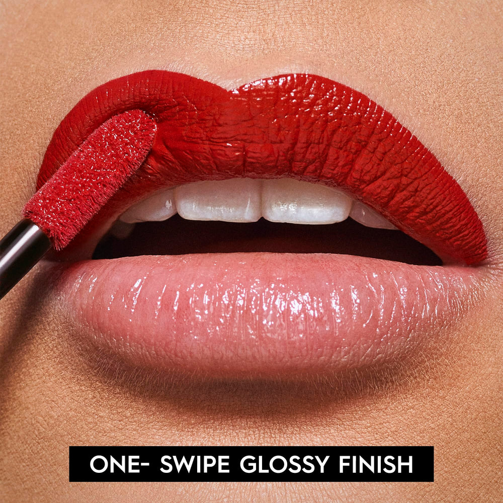 Urban Decay Vice Lip Bond in Unbreakable red for bold daytime look.