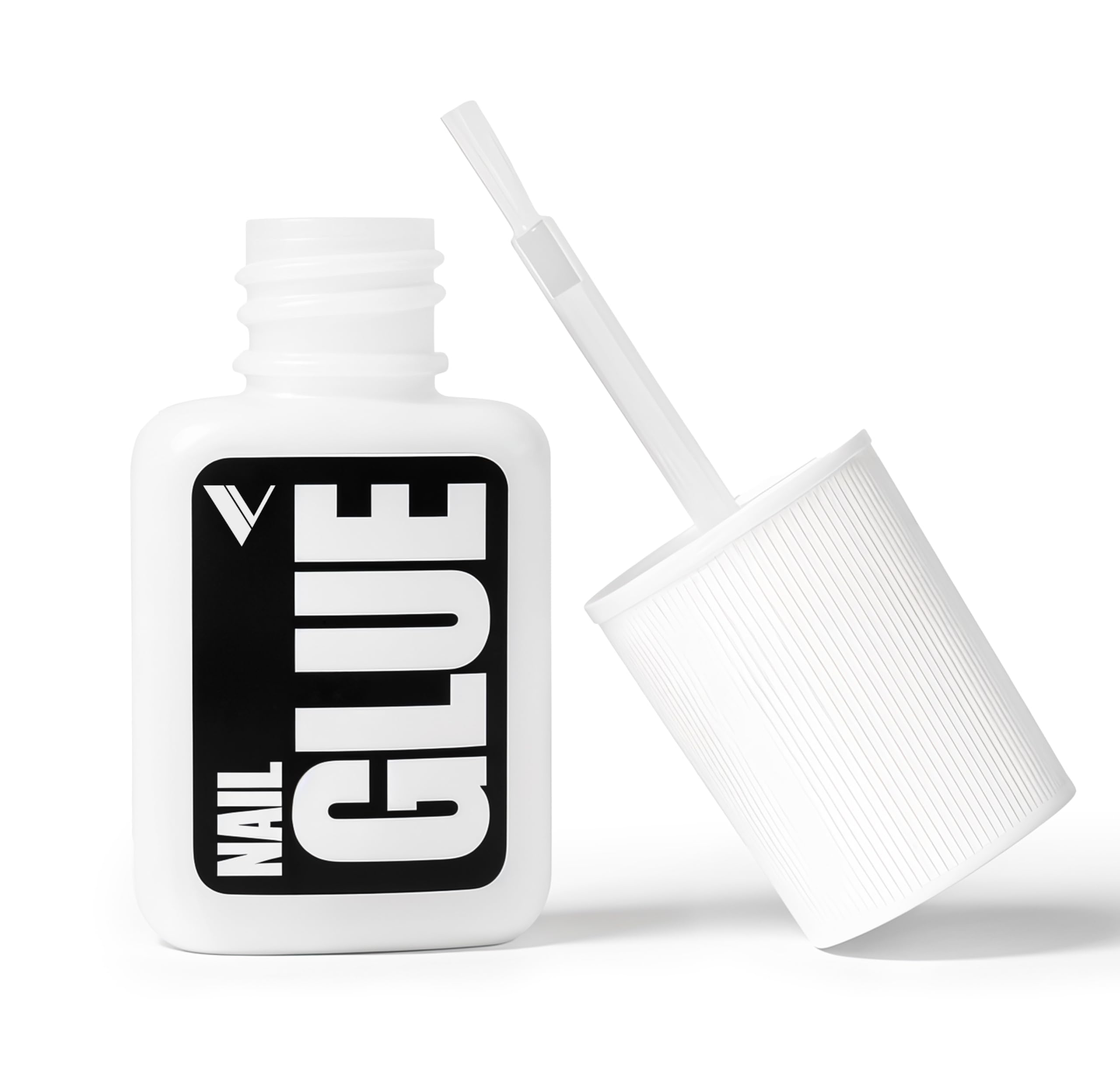 V Beauty Pure nail glue bottle close-up with precision brush for clean edges.