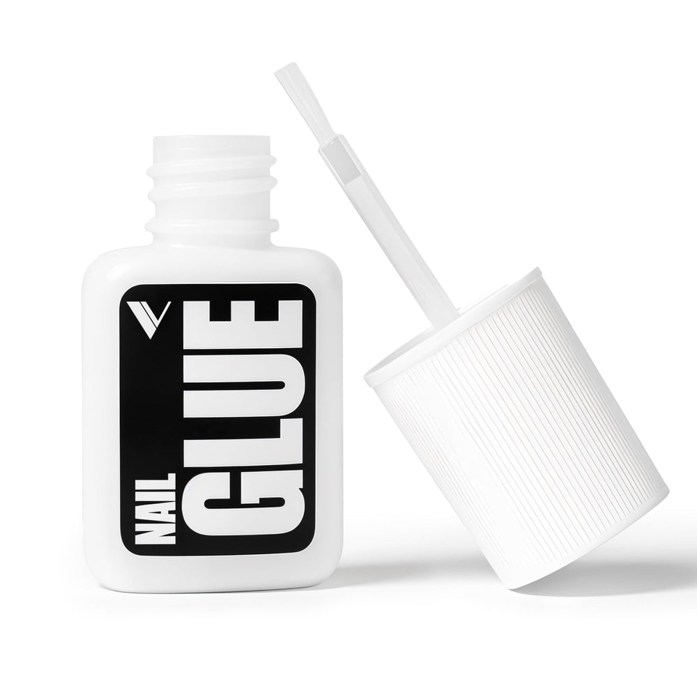 V Beauty Pure nail glue bottle close-up with precision brush for clean edges.