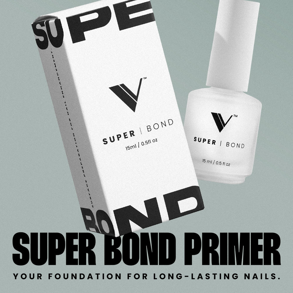 Primer application close-up shows smooth, even coverage for secure nail adhesion.
