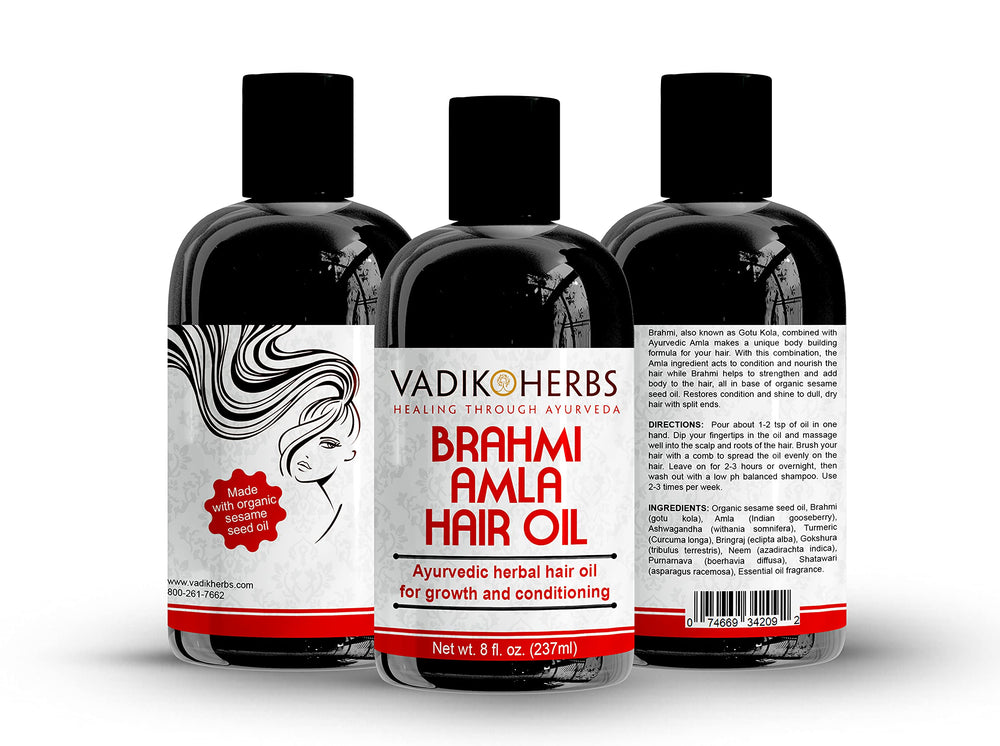 Dropper applying Vadik Herbs Brahmi Amla Hair Oil to scalp for healthier roots