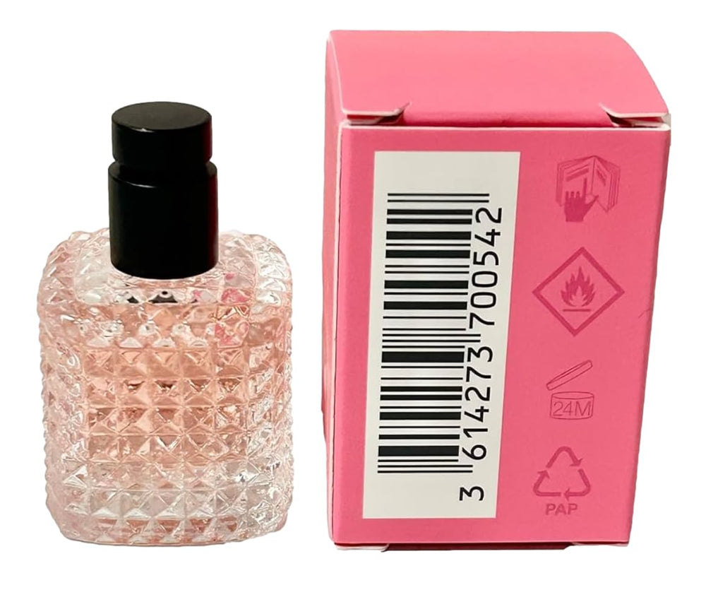 Valentino Born In Roma EDP mini bottle on skin for a test-friendly moment.