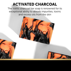 VALITIC charcoal kojic turmeric soap texture close-up shows grainy charcoal and creamy lather.