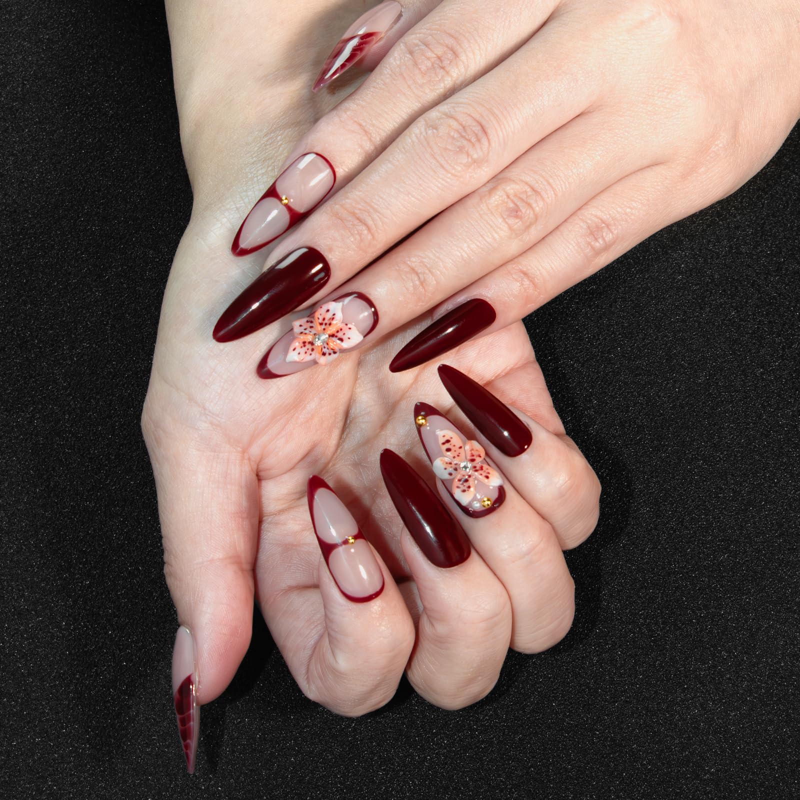 Vanpaga long burgundy stiletto nails with a glossy finish