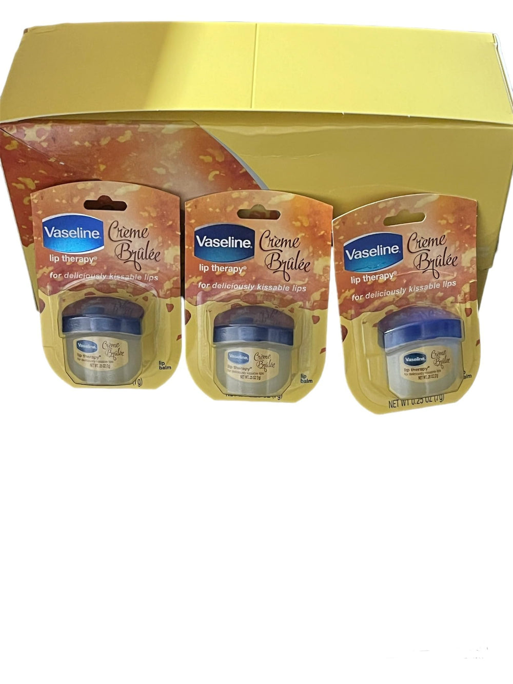 Vaseline Lip Creme Brulee tube close-up showing portable lip care for on-the-go moisture.