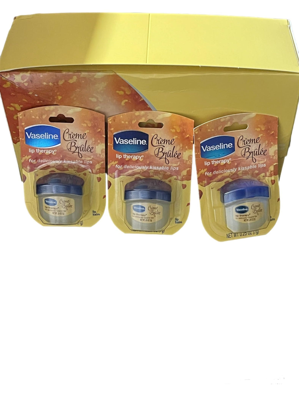 Vaseline Lip Creme Brulee tube close-up showing portable lip care for on-the-go moisture.