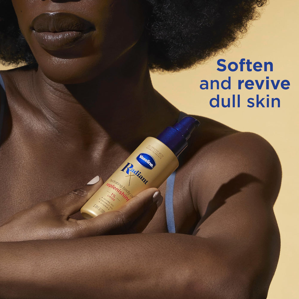 Vaseline Radiant X hands applying oil deliver immediate nourishment.