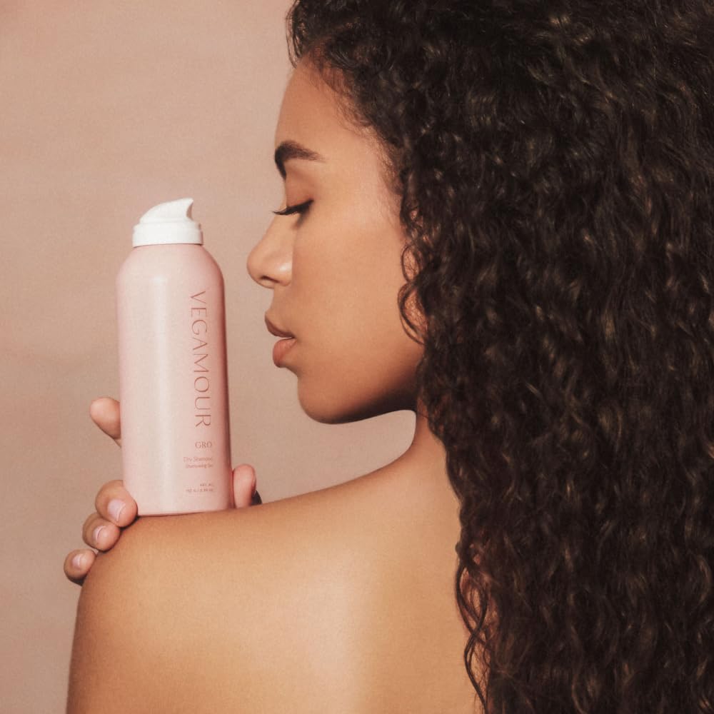 VEGAMOUR GRO Dry Shampoo with plant-based ingredients like rice starch and kaolin.