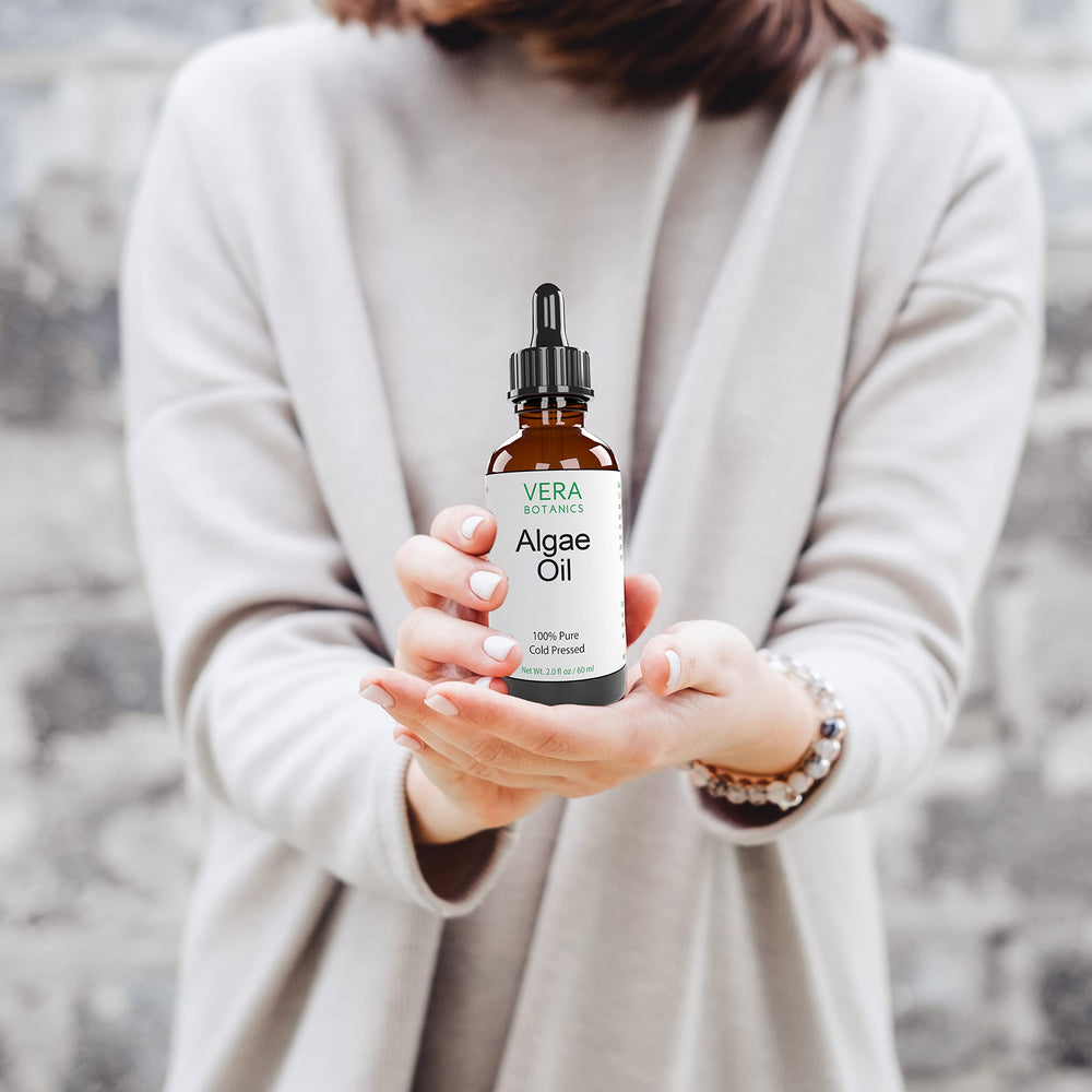 Soothing application of Vera Botanics Algae Oil on skin for comfort.