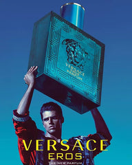 Versace Eros Parfum bottle with dramatic lighting emphasizes sensual presence.