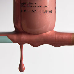 Versed Mood Lighting Glow Drops bronzed pump shows serum-like texture for hydrating glow.