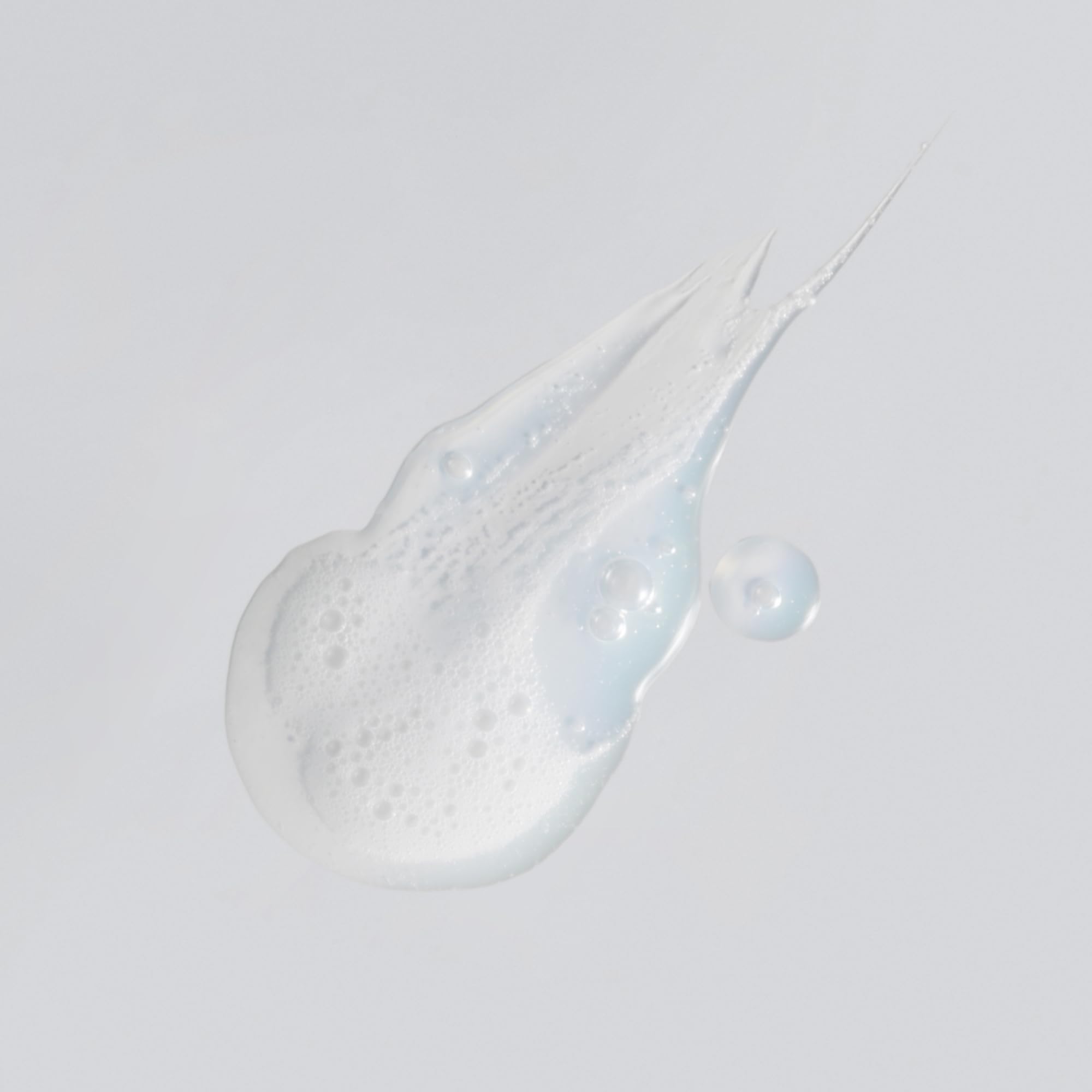 Versed Purist foaming cleanser demonstrates a soft, plush lather for clean skin.