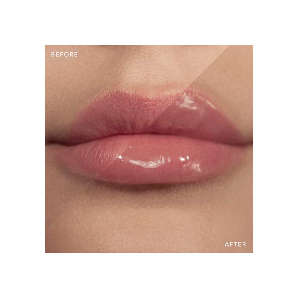 Victoria Beckham Beauty High Gloss Lip Gloss packaging sits on a chic vanity.