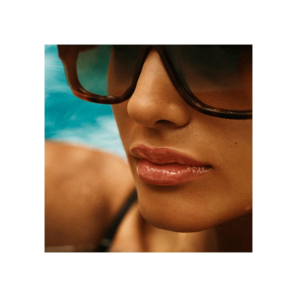 Victoria Beckham Beauty High Gloss Lip Gloss on lips adds plush shine and dimension.