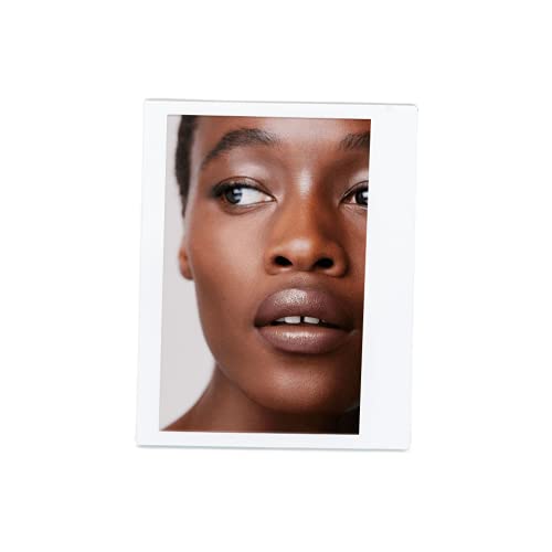 Victoria Beckham Posh Lipstick on lips demonstrates refined satin sheen for daytime use.