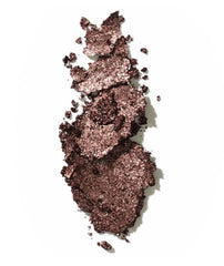 Victoria Beckham Beauty Shimmery Lid Lustre applied to eyelid for subtle glow.