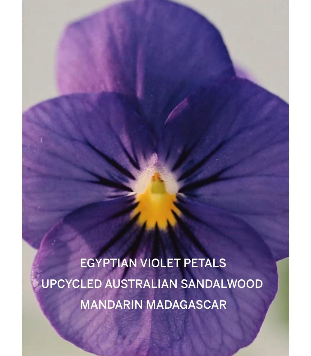 Victoria's Secret Bare mini mist spray captured mid-application for day-long scent.