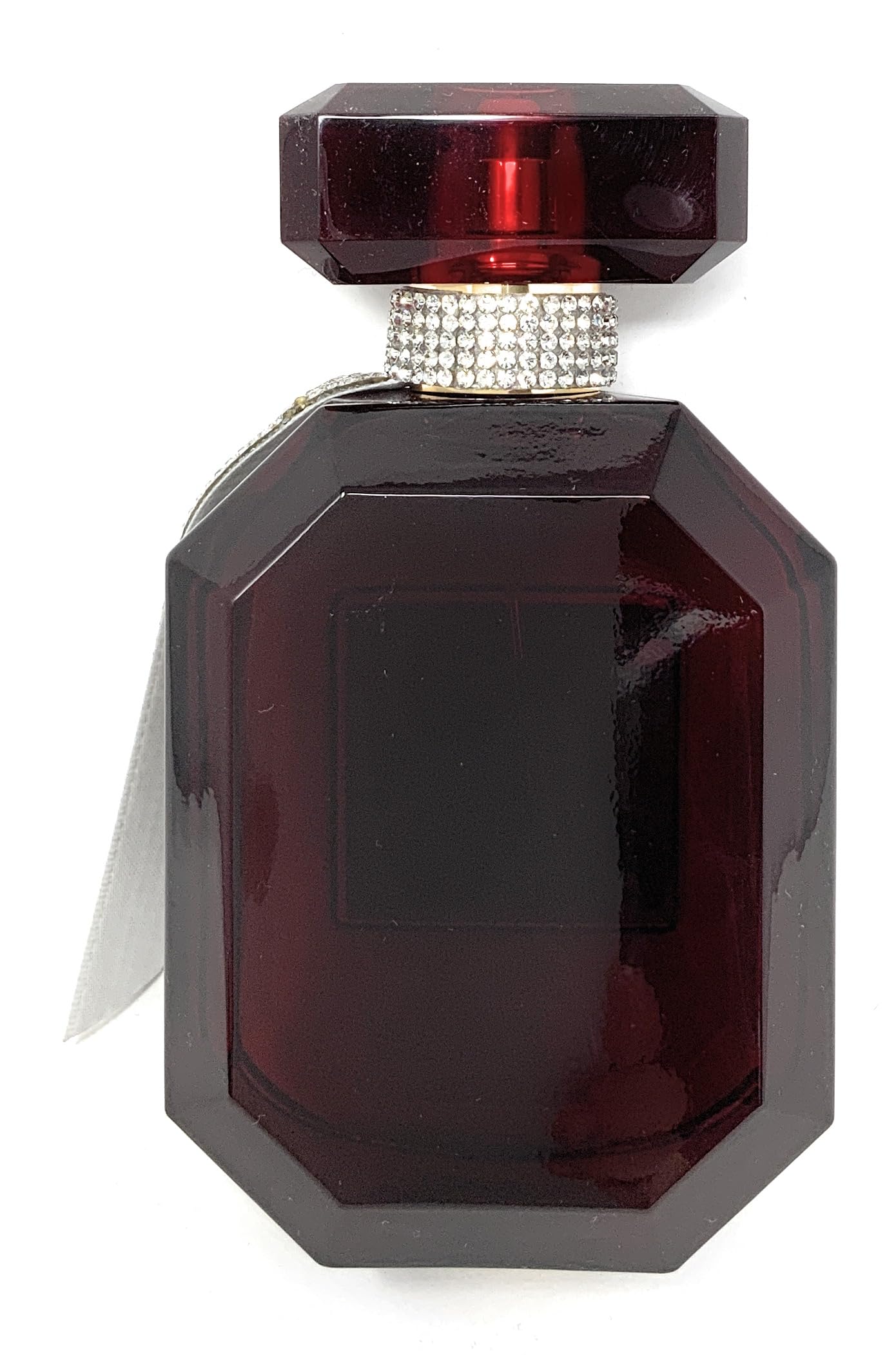 Victoria's Secret Bombshell Midnight warm glow ambience image, suggesting evening wear fragrance.