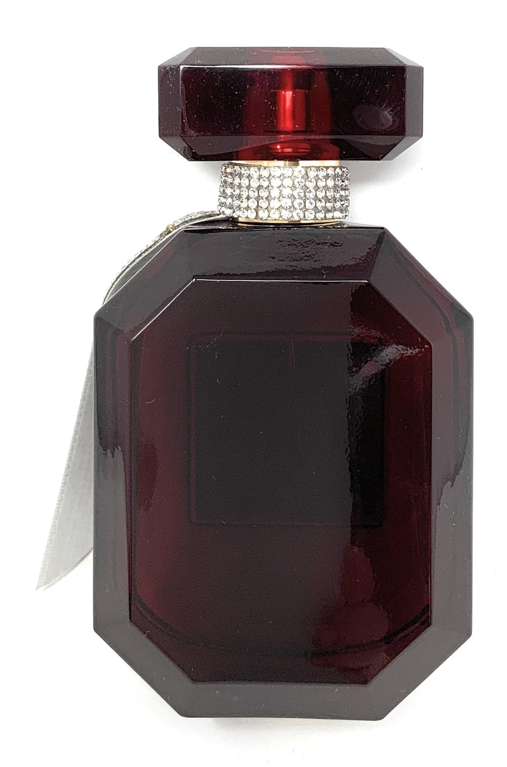 Victoria's Secret Bombshell Midnight warm glow ambience image, suggesting evening wear fragrance.