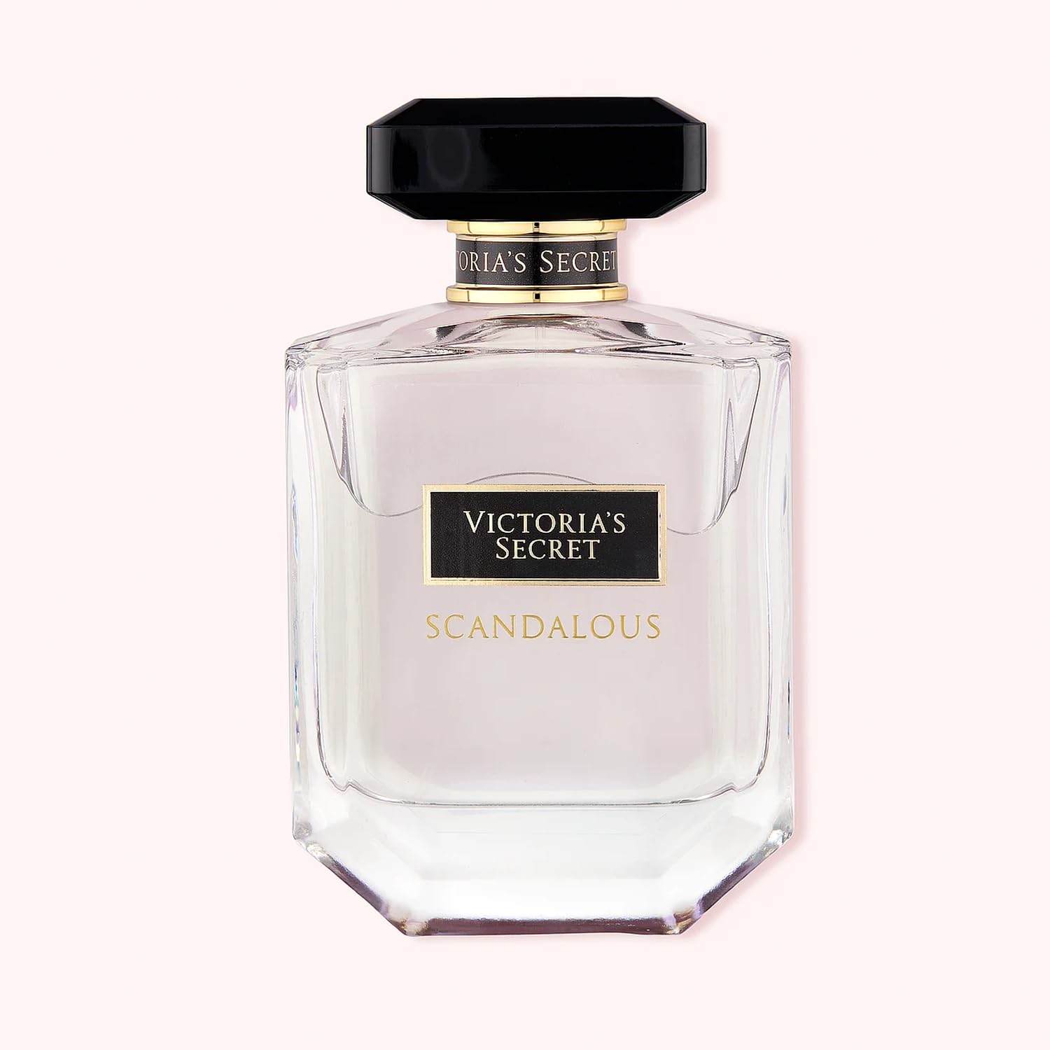 Hand applying Victoria's Secret Scandalous for on-the-go moments.