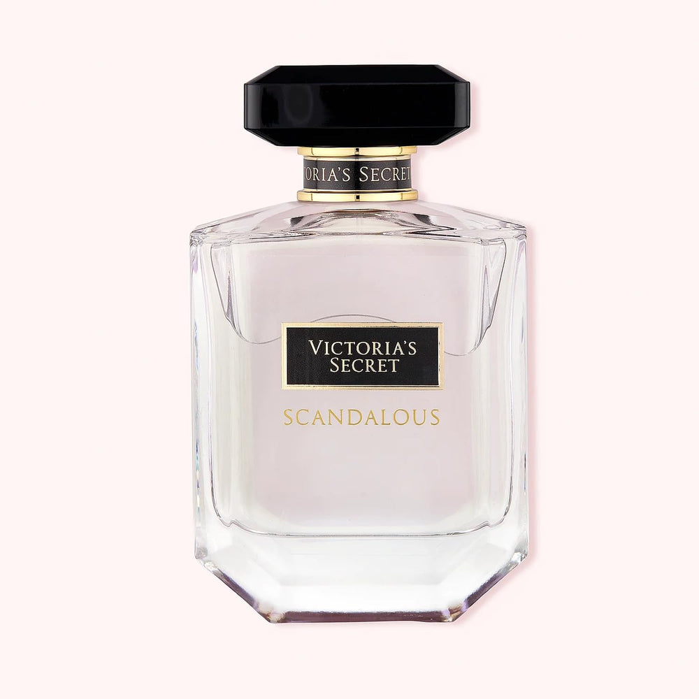 Hand applying Victoria's Secret Scandalous for on-the-go moments.