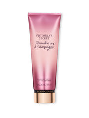 Victoria's Secret Strawberries & Champagne lotion bottle delivers light hydration with a fruity-floral scent.