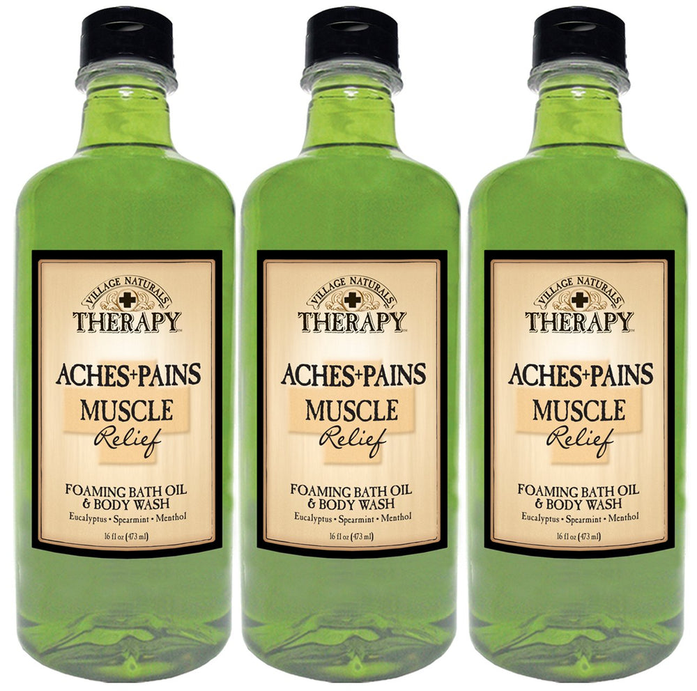 Village Naturals Therapy bottle front highlighting muscle relief bath oil for tub use.