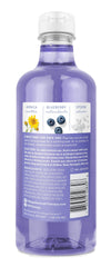 Village Naturals Therapy Comfort Foaming Bath Oil pours for a relaxing soak.
