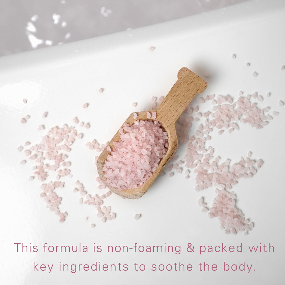Village Naturals Therapy Glow bottle against Moroccan decor evokes luxury bath time