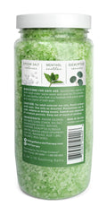Pouring Village Naturals Therapy Muscle Bath Soak into warm water for refreshment