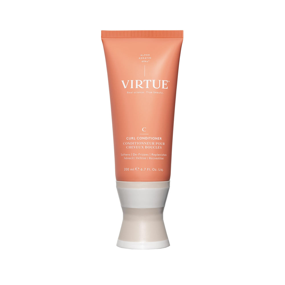 VIRTUE Curl Conditioner bottle with jojoba oil delivering hydrated curls.