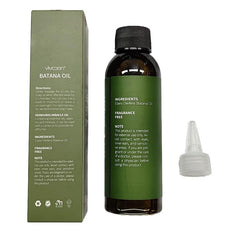 Vivccon Batana Oil being poured for even application.