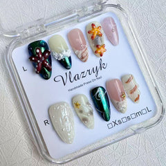 Vlazryk mermaid chrome almond nails with pearl shell accents for sea-inspired shimmer