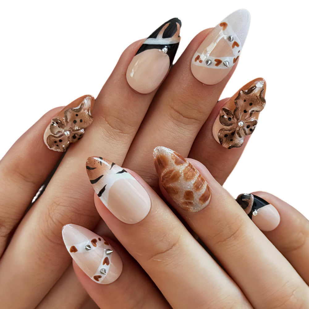 Vlazryk nails with rhinestone flower design for classy sparkle at weddings and celebrations.