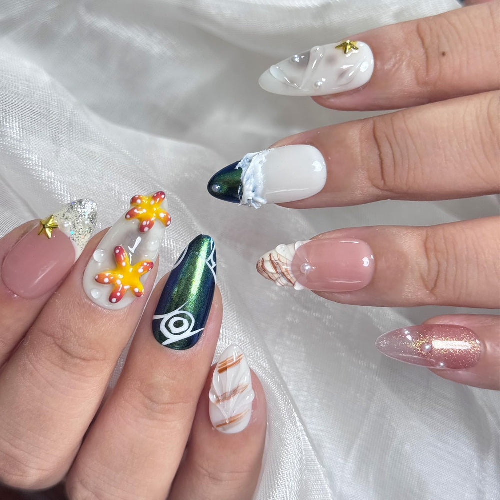 Vlazryk nails with pearl shell accents add tactile luxury to the design
