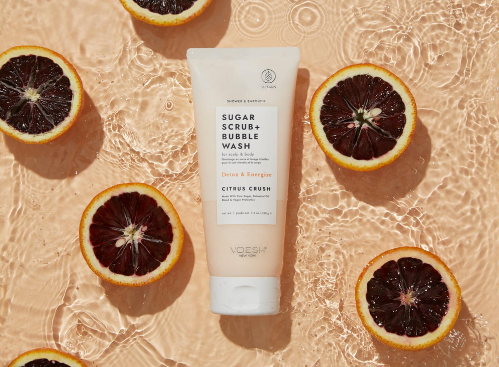 VOESH Citrus Crush sugar scrub texture closeup showing gentle buffing.