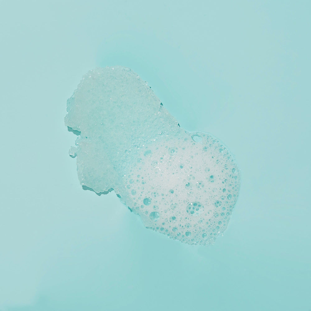 VOESH sugar scrub forming rich lather on skin.