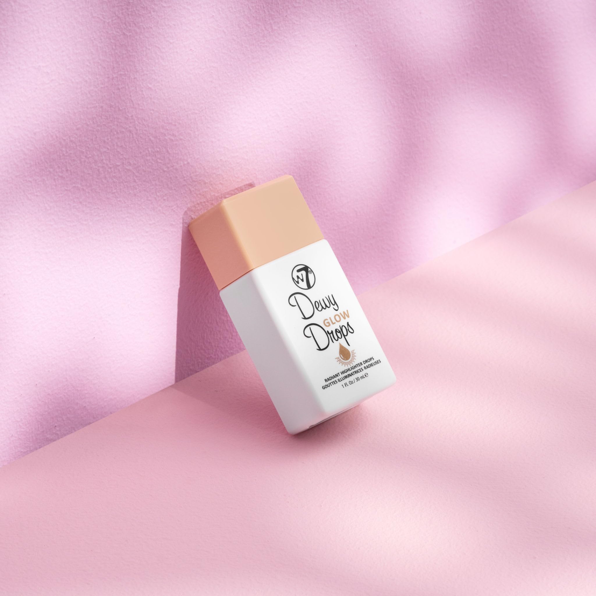 W7 Dewy Glow Drops on cheeks create buildable golden-hour radiance.