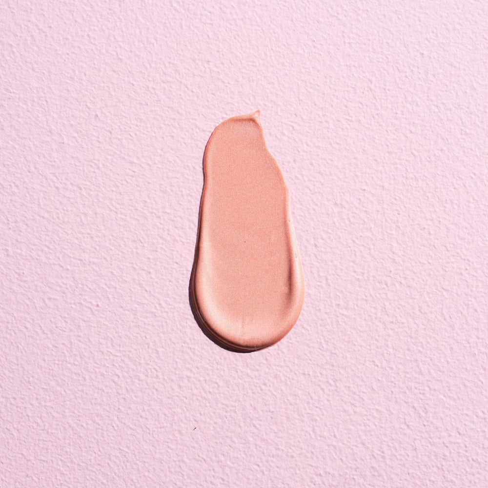 W7 Sweet Glow Drops rose tint applied to cheeks for radiant look